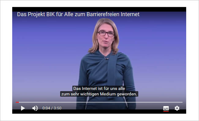 YouTube Player mit eingeblendetem Untertitel und Bedienleiste, die UT-Schaltfläche ist hervorgehoben